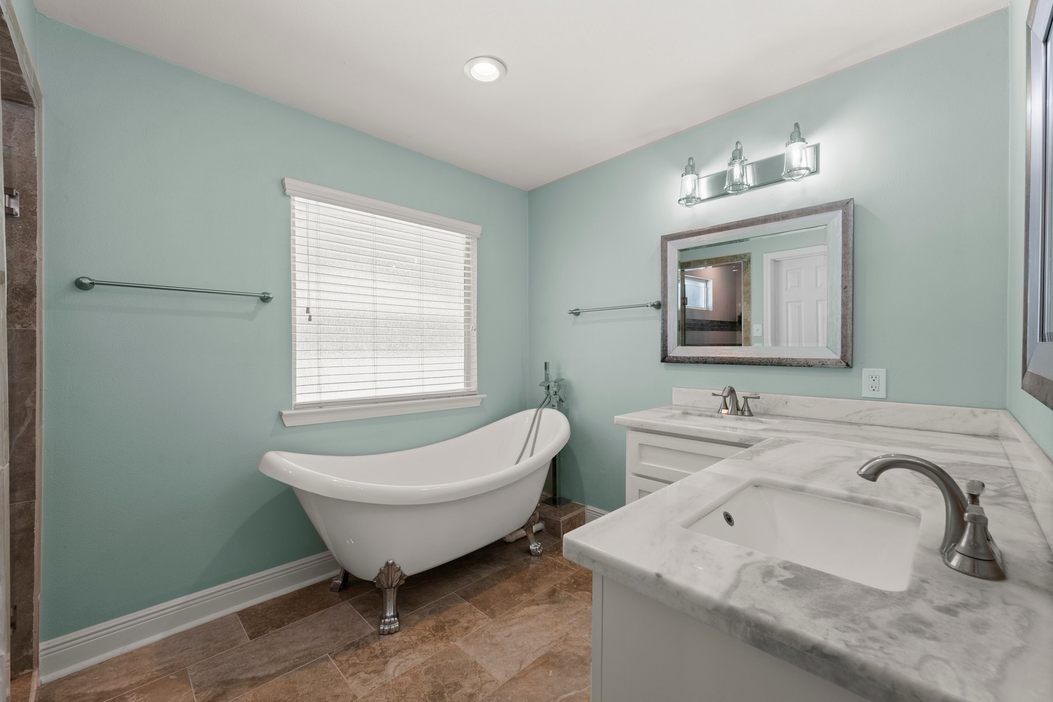 6030 Craigway Road Spring, TX 77389 - Photo 23 of 45 This bathroom features a classic freestanding clawfoot tub. It includes a window for natural light.