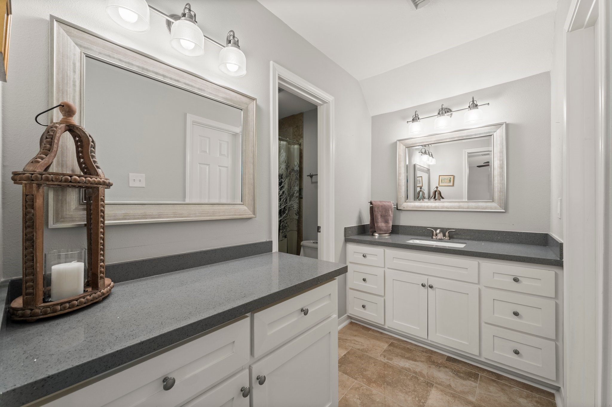6030 Craigway Road Spring, TX 77389 - Photo 28 of 45 Bathroom features a modern design with dual sinks, sleek gray countertops, and ample white cabinetry.