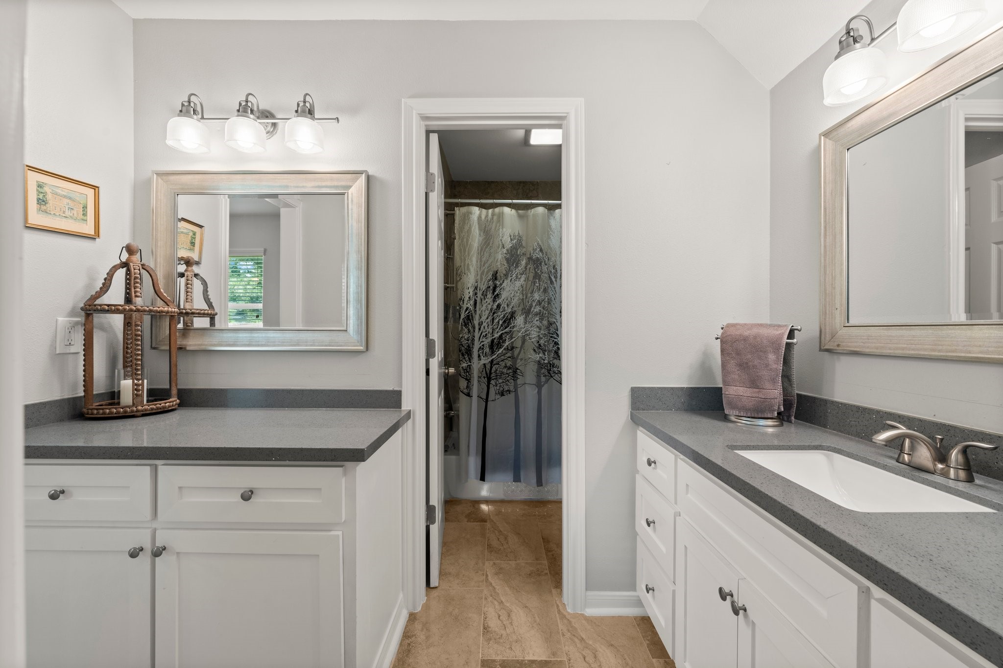 6030 Craigway Road Spring, TX 77389 - Photo 29 of 45 Bathroom features a modern design with dual vanities, sleek gray countertops, and white cabinetry.