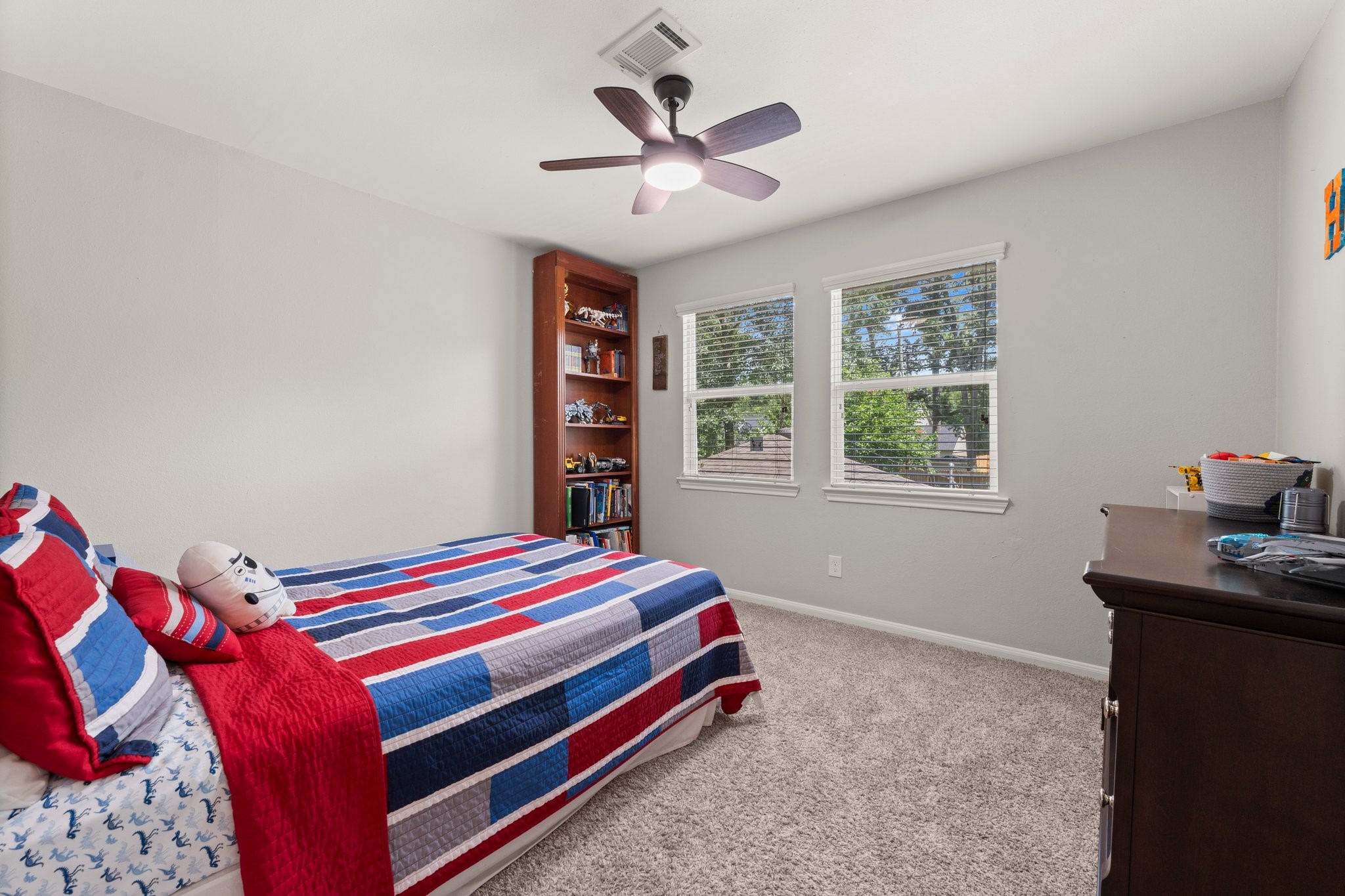 6030 Craigway Road Spring, TX 77389 - Photo 31 of 45 This secondary bedroom features cozy carpeting, a ceiling fan, and ample natural light from two windows.