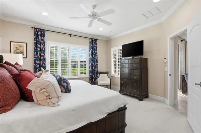 a bedroom with a bed and a flat screen television