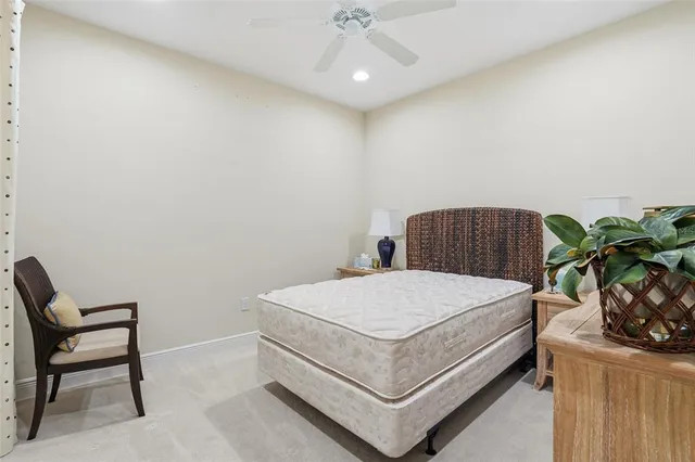 a bedroom with a bed and a chair