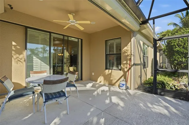 a building outdoor space with patio furniture and potted plants