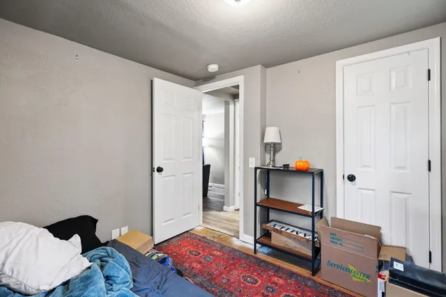 a bedroom with furniture and a window