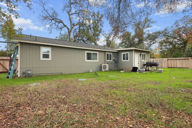 a backyard of a house with seating space