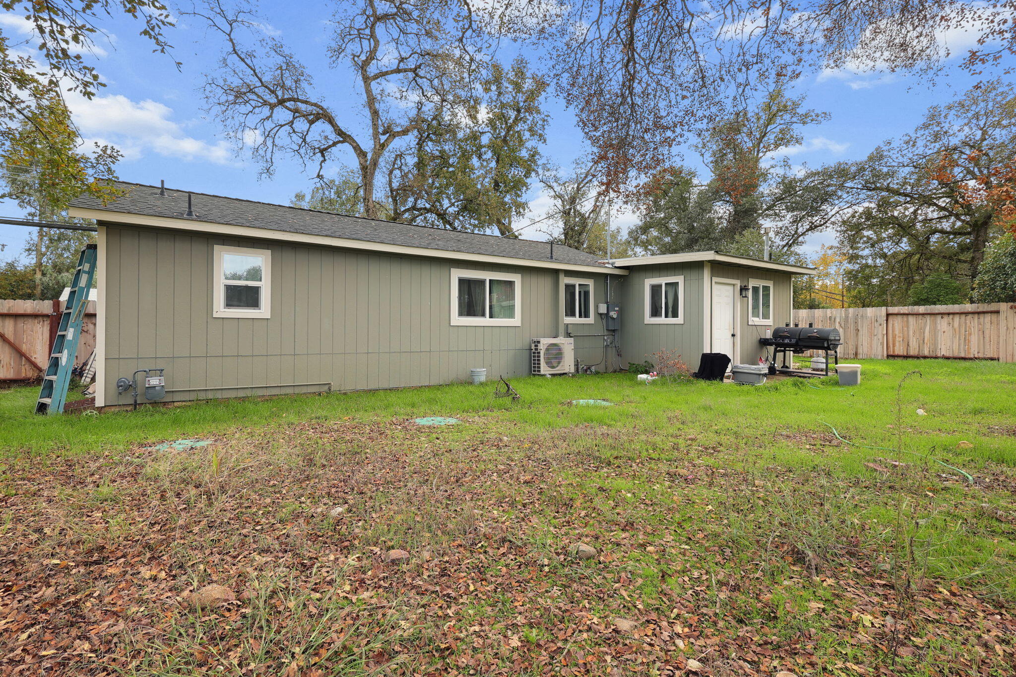 7696 Happy Valley Road Anderson, CA 96007 - Photo 16 of 24 a backyard of a house with seating space