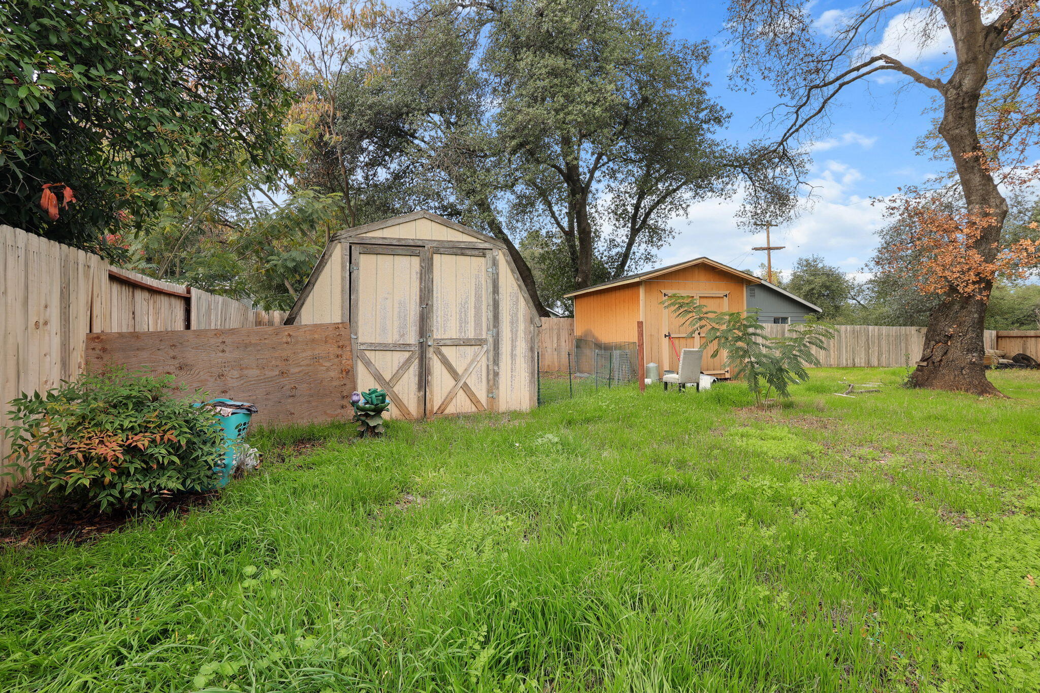 7696 Happy Valley Road Anderson, CA 96007 - Photo 19 of 24 a front view of a house with garden