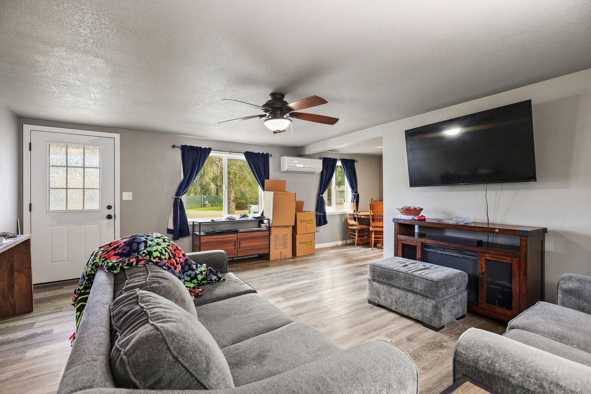 7696 Happy Valley Road Anderson, CA 96007 - Photo 2 of 24 a living room with furniture and a flat screen tv
