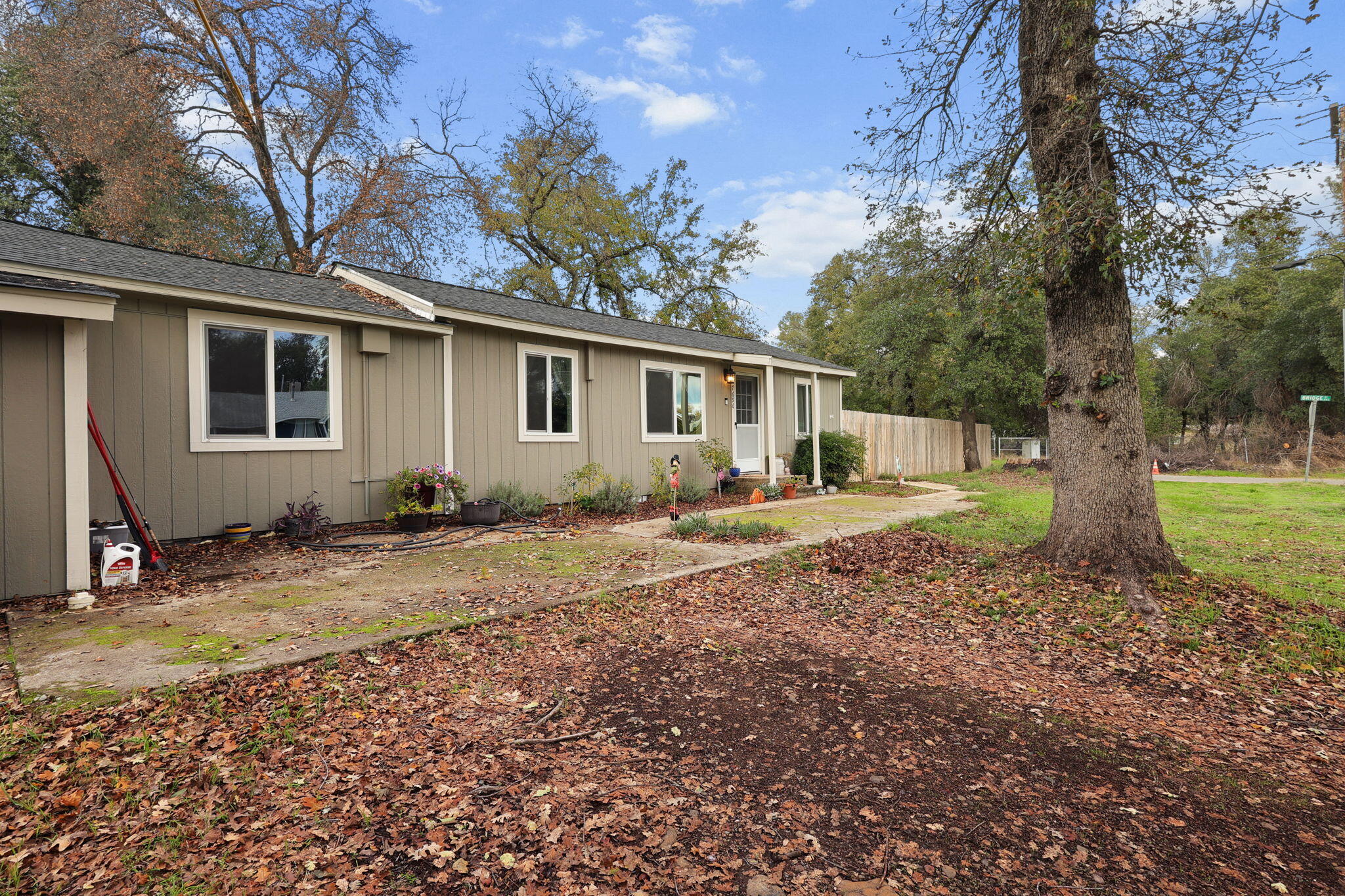 7696 Happy Valley Road Anderson, CA 96007 - Photo 21 of 24 a backyard of a house with yard and outdoor seating