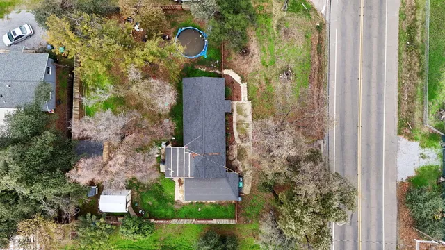 an aerial view of a house with outdoor space
