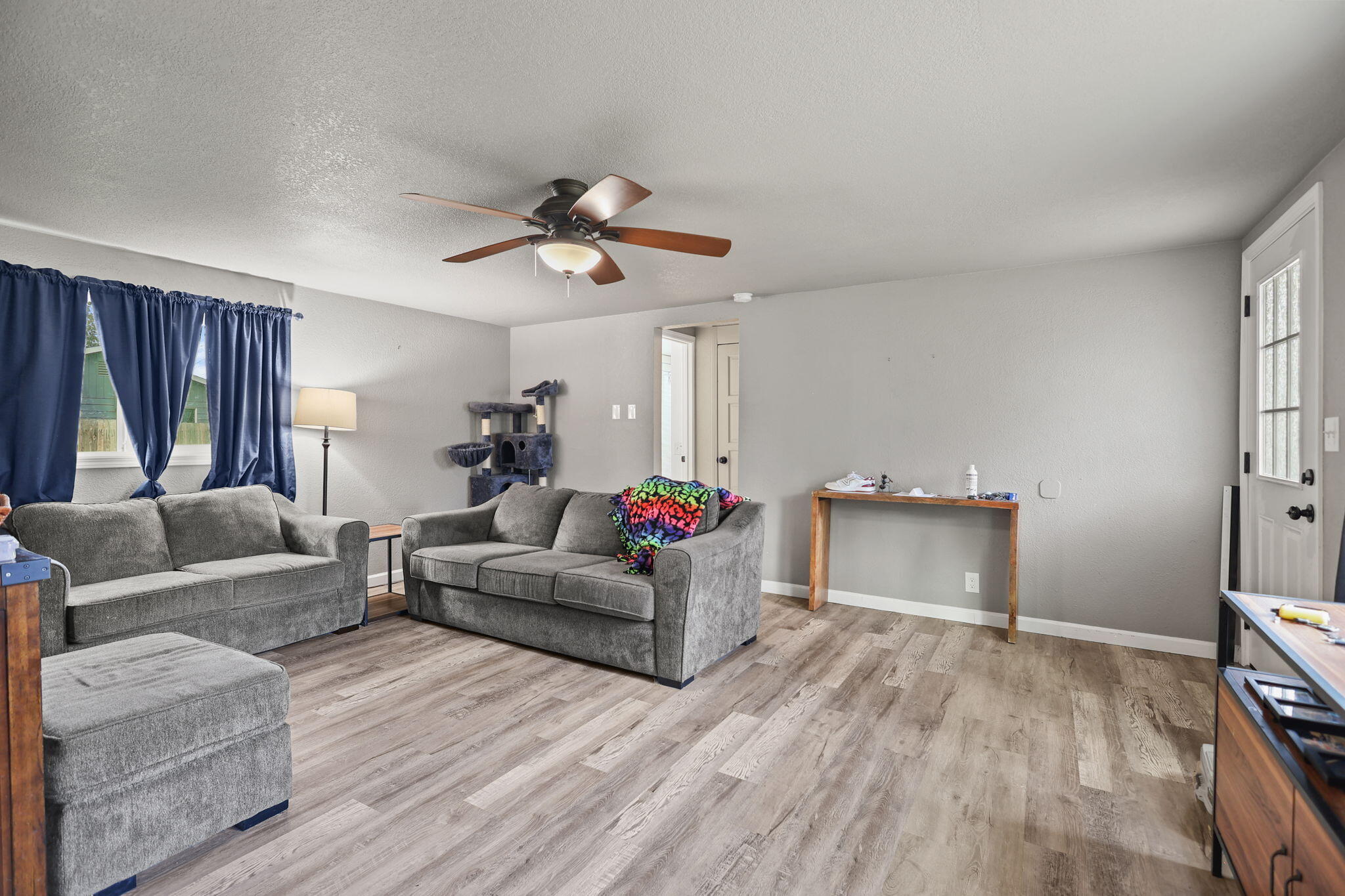 7696 Happy Valley Road Anderson, CA 96007 - Photo 3 of 24 a living room with furniture and a wooden floor
