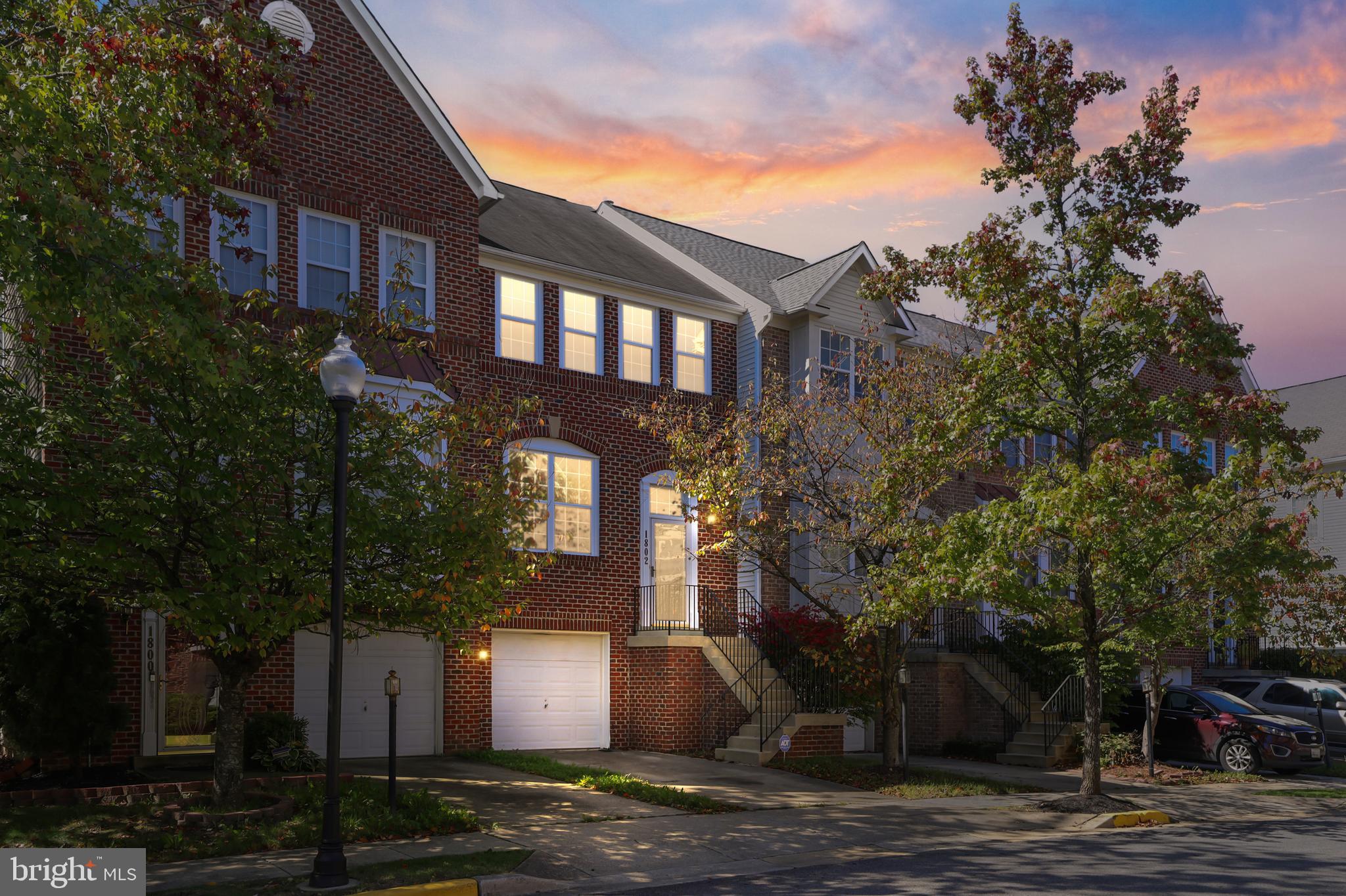 1802 Spanish Oak Lane Bowie, MD 20721 - Photo 1 of 53 a front view of a house with a yard