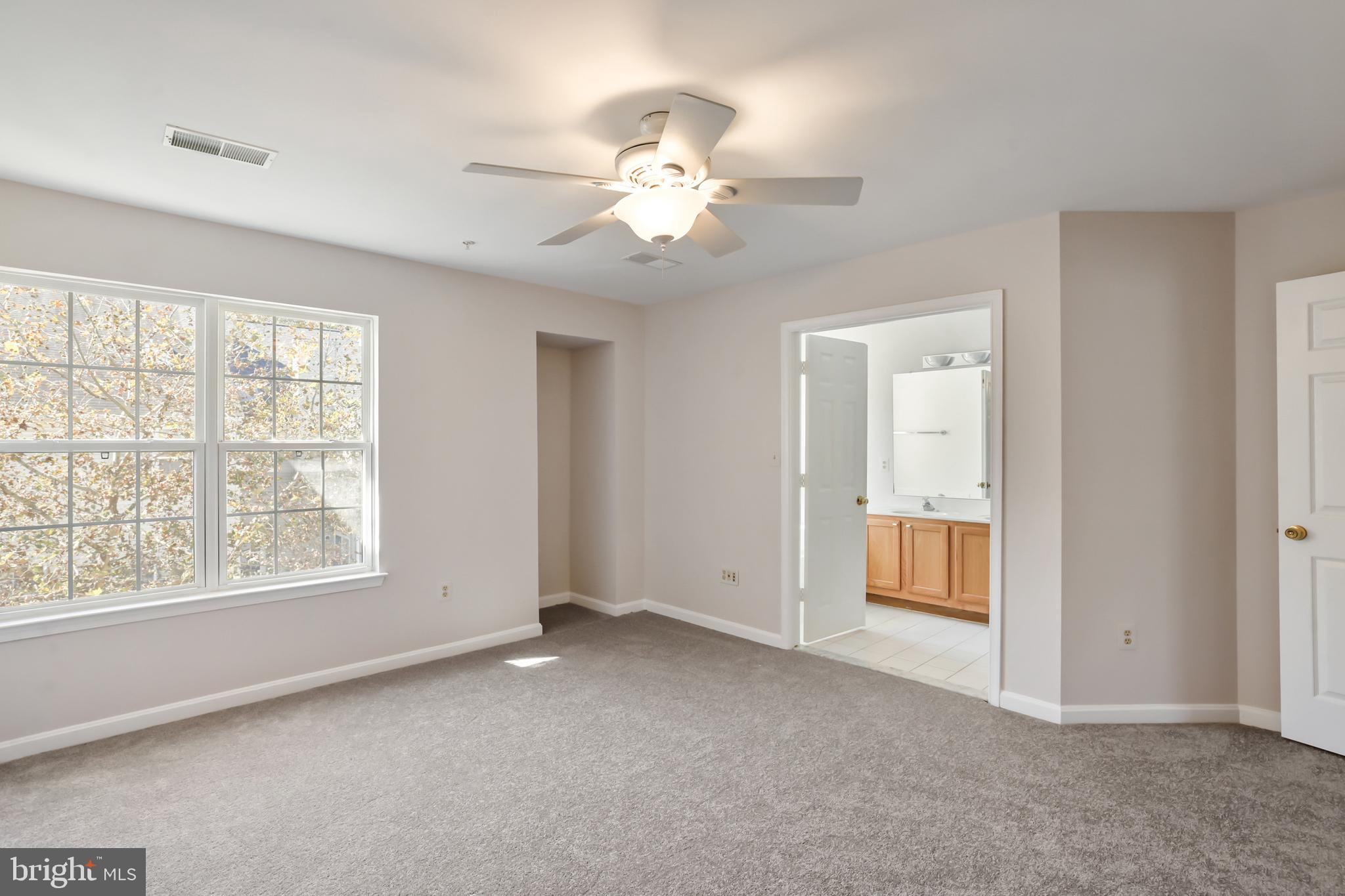 1802 Spanish Oak Lane Bowie, MD 20721 - Photo 14 of 53 a view of a livingroom with a ceiling fan and window