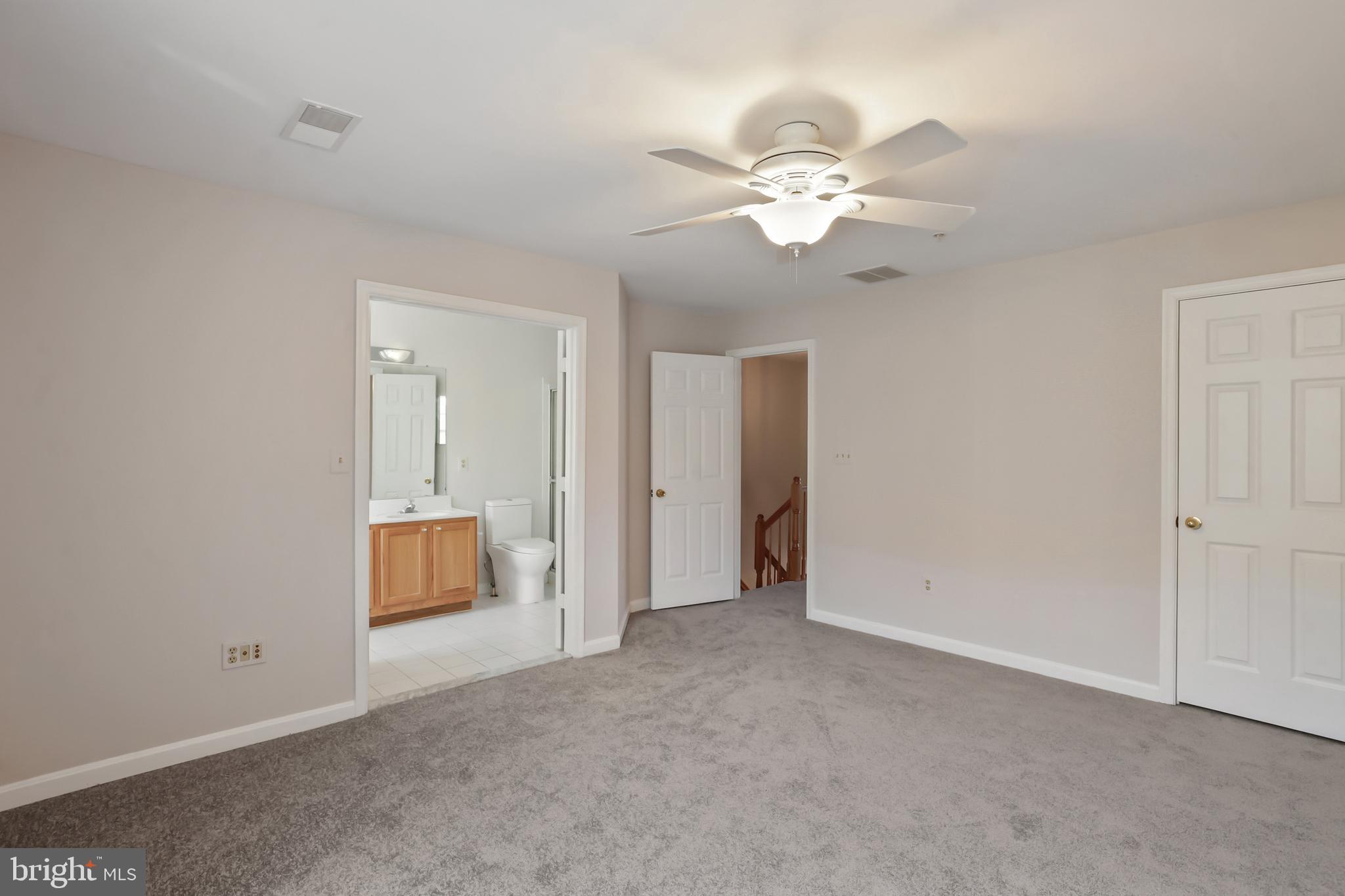 1802 Spanish Oak Lane Bowie, MD 20721 - Photo 15 of 53 a view of an empty room with a fan