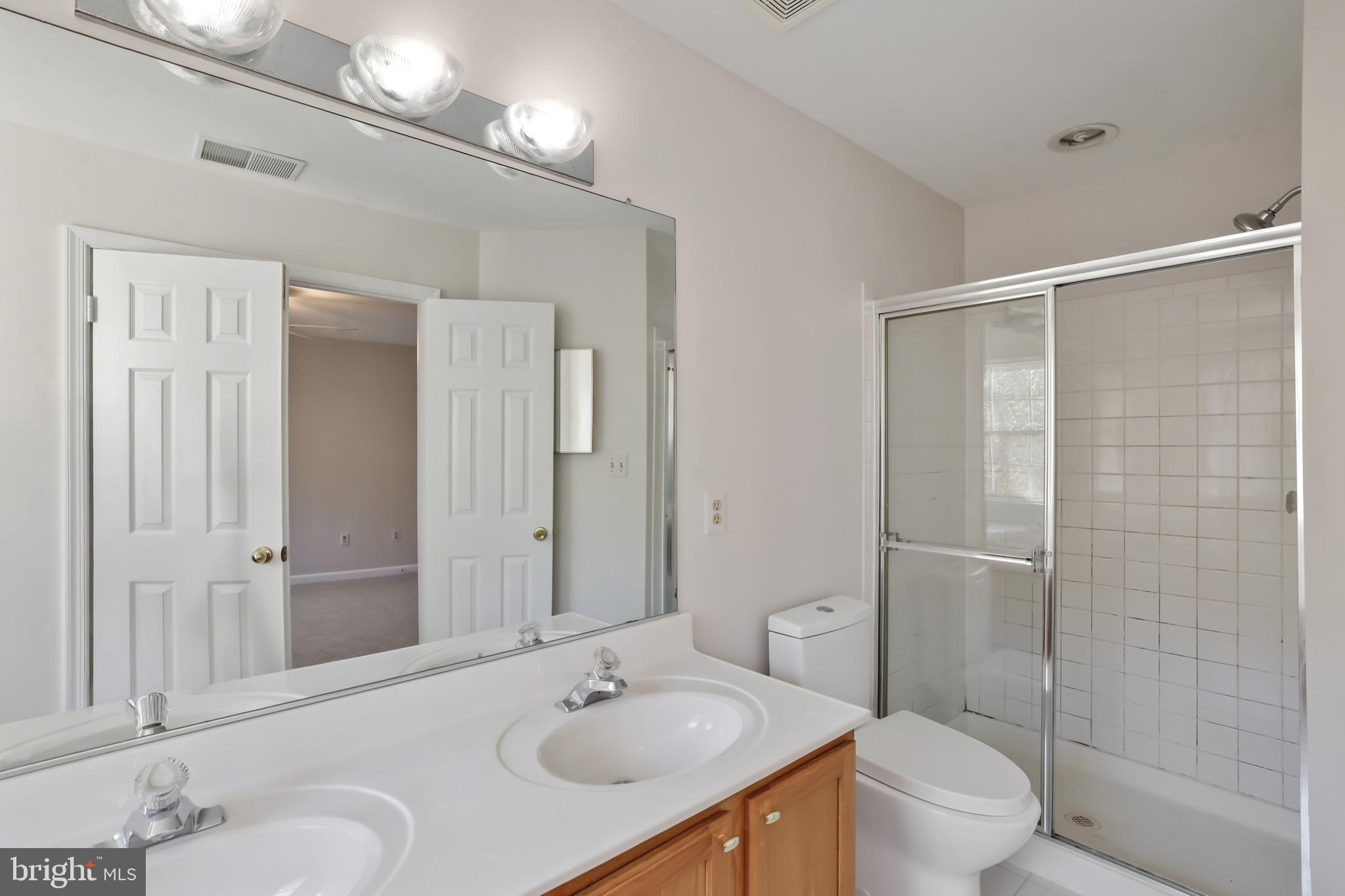 1802 Spanish Oak Lane Bowie, MD 20721 - Photo 18 of 53 a bathroom with a sink toilet and shower