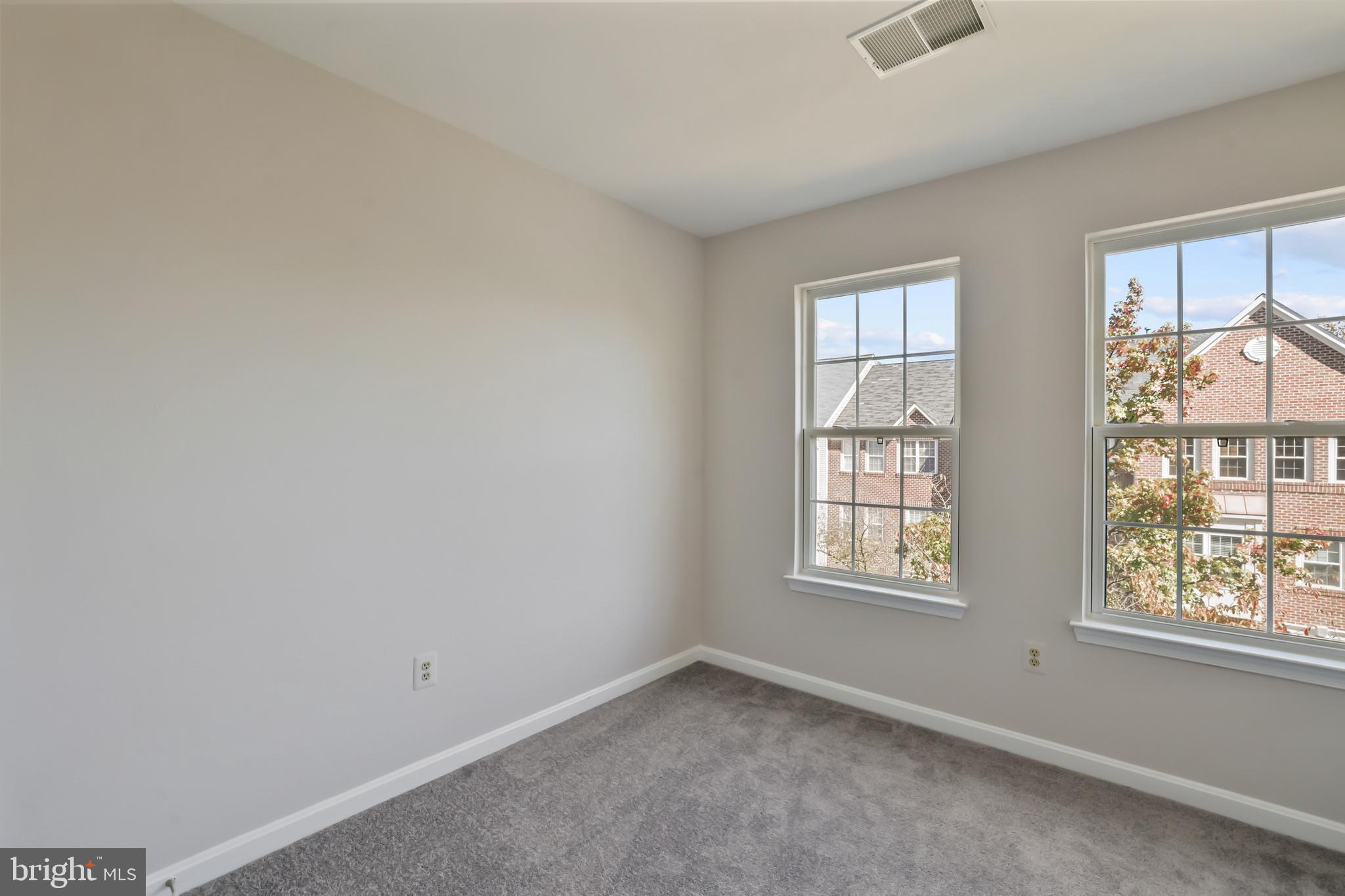 1802 Spanish Oak Lane Bowie, MD 20721 - Photo 23 of 53 an empty room with windows