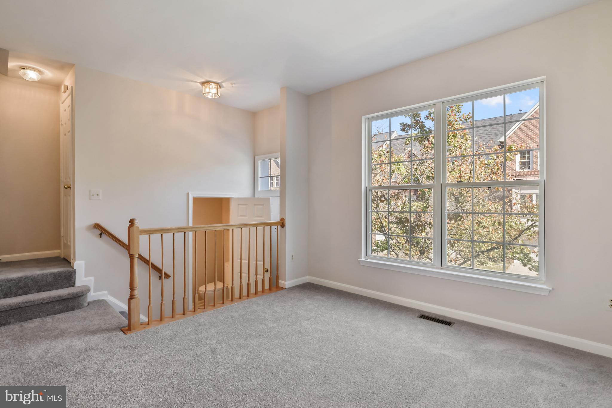1802 Spanish Oak Lane Bowie, MD 20721 - Photo 4 of 53 a view of an empty room with a window