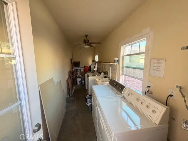 a view of living room with furniture and a window