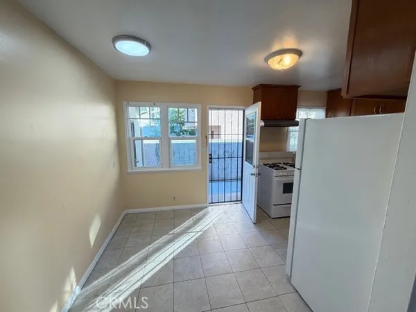 a kitchen with stainless steel appliances a refrigerator and a stove