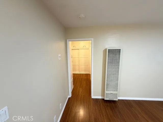a view of wooden floor and windows in a room