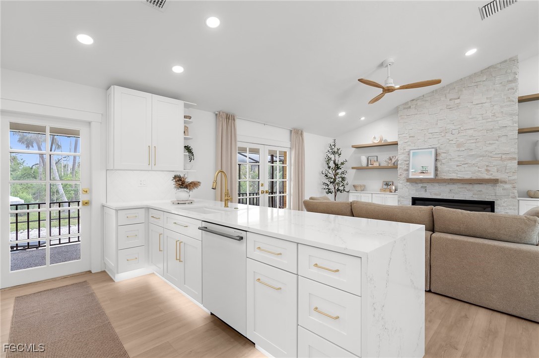 13270 Electron Drive Fort Myers, FL 33908 - Photo 14 of 47 a kitchen with white cabinets and sink