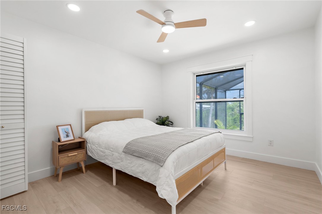 13270 Electron Drive Fort Myers, FL 33908 - Photo 21 of 47 a bedroom with a bed and a window