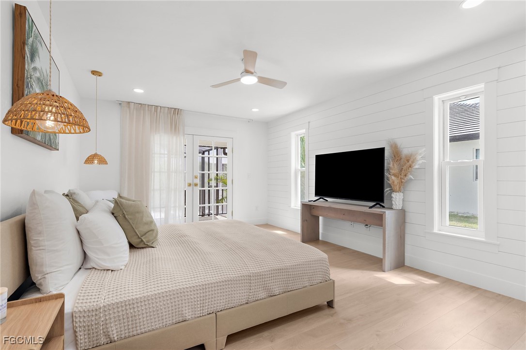 13270 Electron Drive Fort Myers, FL 33908 - Photo 25 of 47 a bedroom with a bed and a flat screen tv