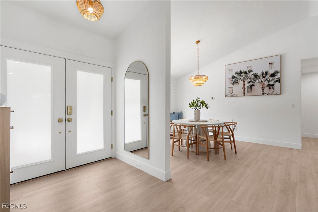 13270 Electron Drive Fort Myers, FL 33908 - Photo 5 of 47 a view of a dining room with furniture window and wooden floor