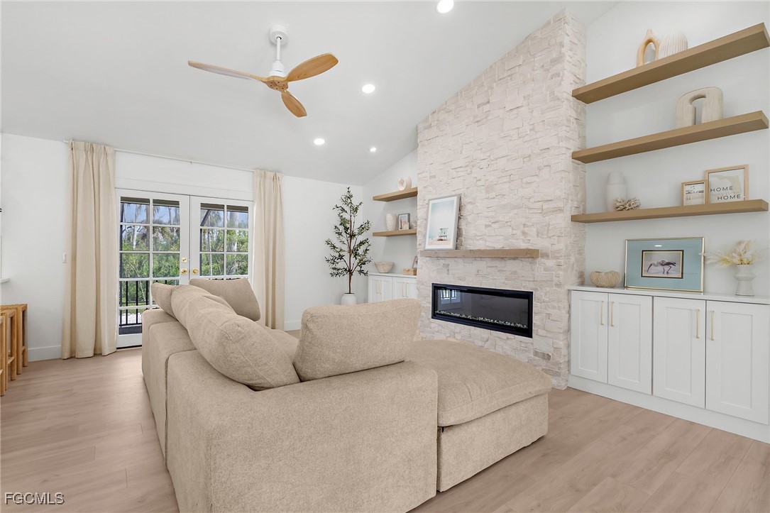 13270 Electron Drive Fort Myers, FL 33908 - Photo 7 of 47 a living room with furniture and a fireplace
