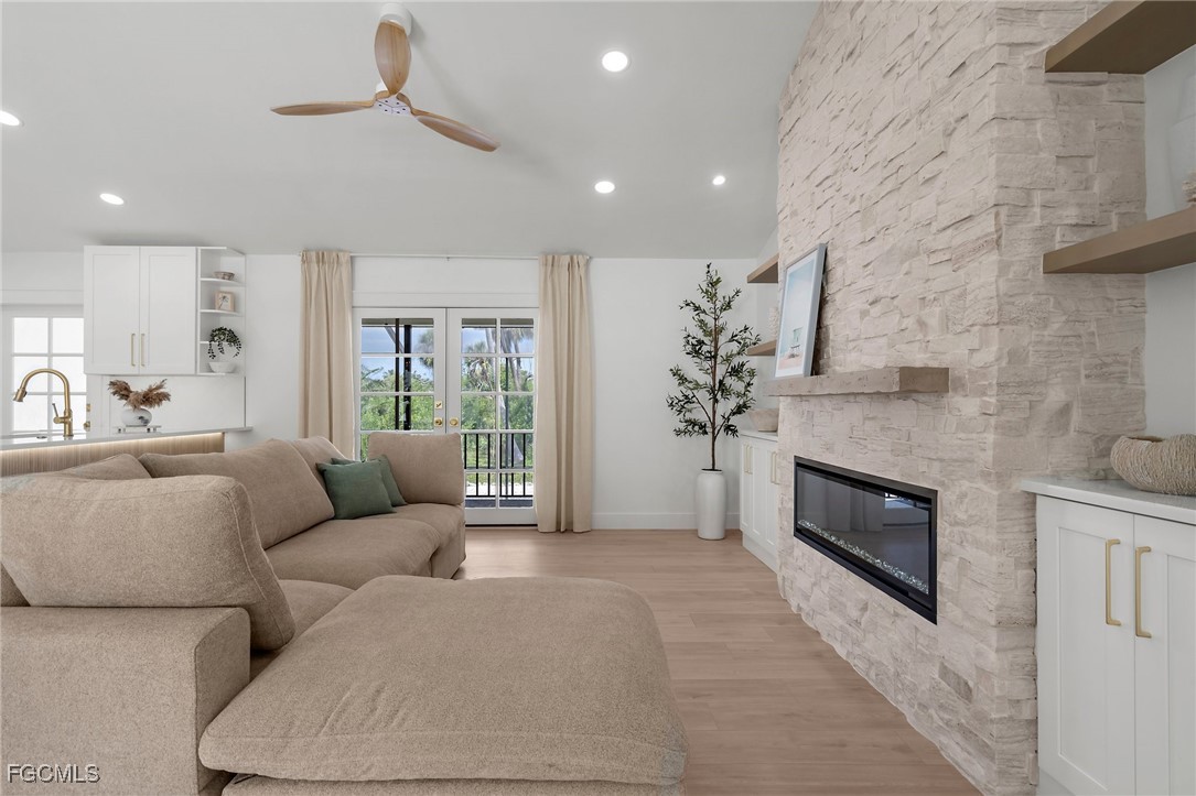 13270 Electron Drive Fort Myers, FL 33908 - Photo 8 of 47 a living room with furniture and a fireplace