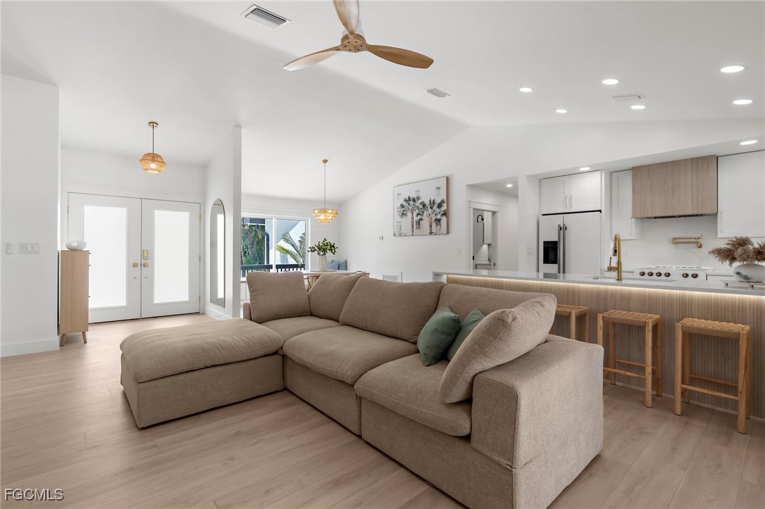 13270 Electron Drive Fort Myers, FL 33908 - Photo 9 of 47 a living room with furniture and a large window