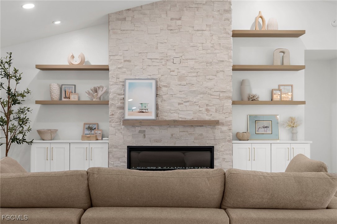 13270 Electron Drive Fort Myers, FL 33908 - Photo 10 of 47 a living room with furniture and a fireplace