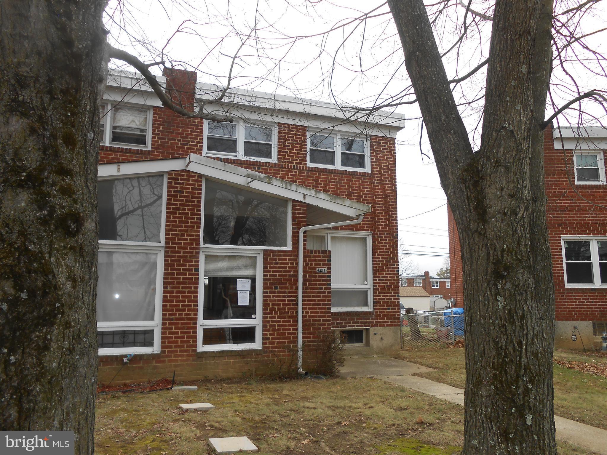 4211 Crest Heights Road Baltimore, MD 21215 - Photo 1 of 21 a view of a house with a tree in front of it