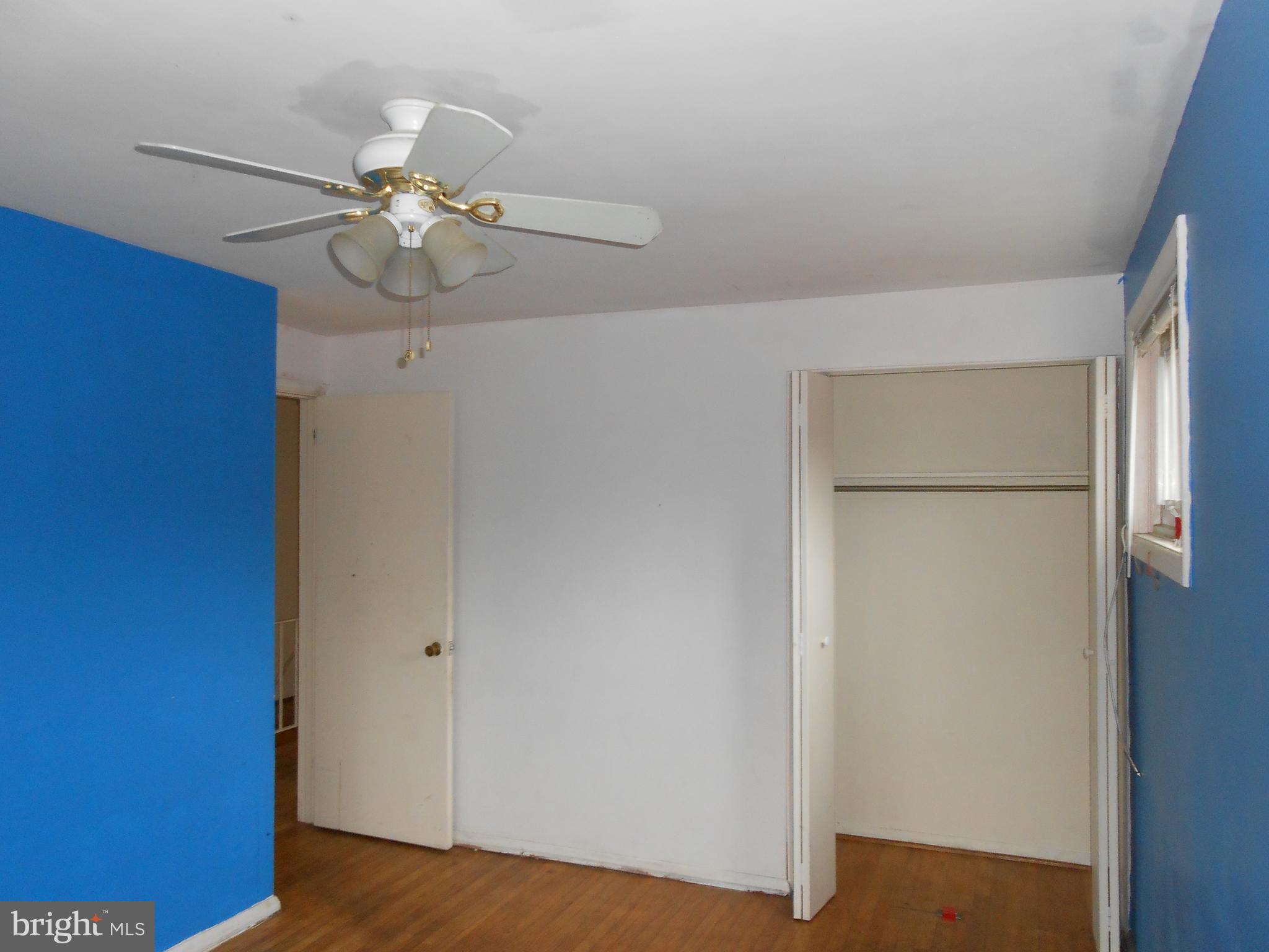 4211 Crest Heights Road Baltimore, MD 21215 - Photo 20 of 21 a view of an empty room with wooden floor