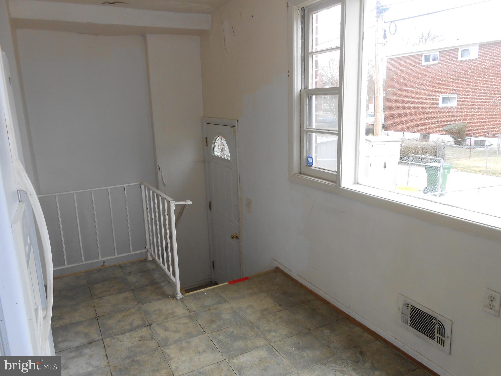 4211 Crest Heights Road Baltimore, MD 21215 - Photo 10 of 21 a view of an empty room with a window