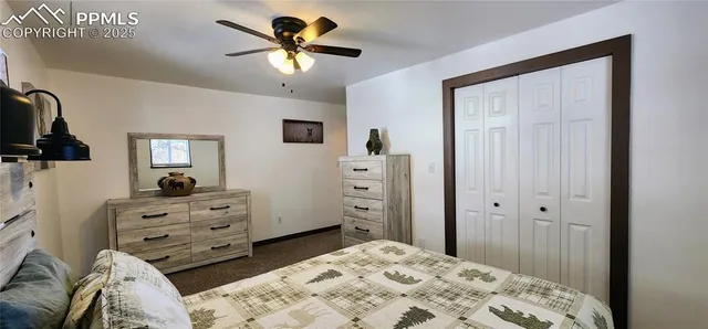 a bedroom with a bed and a television