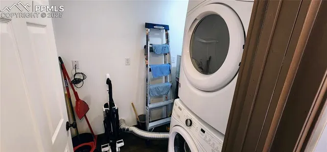 a close view of a utility room with dryer and washer
