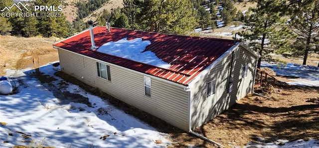a view of a backyard with large trees