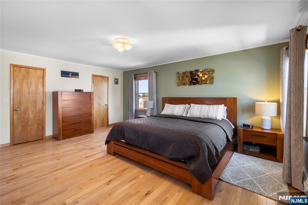 66 Roehrs Drive Wallington, NJ 07057 - Photo 14 of 37 a spacious bedroom with a bed and cabinets