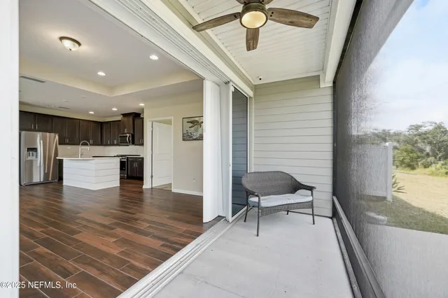 a view of a livingroom with a flat screen tv