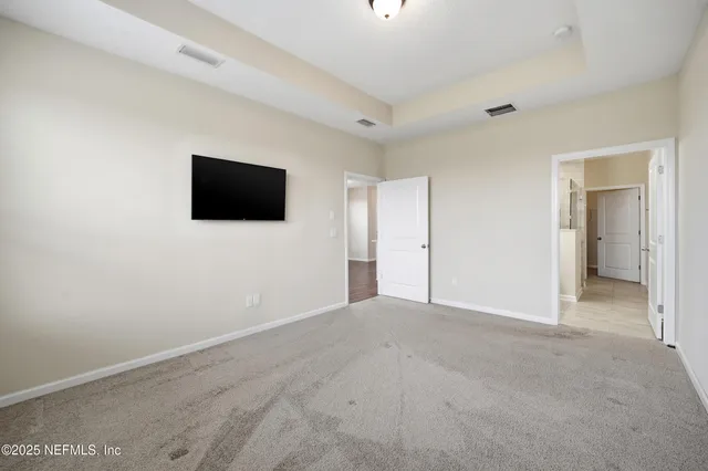 a bathroom with a shower and a mirror