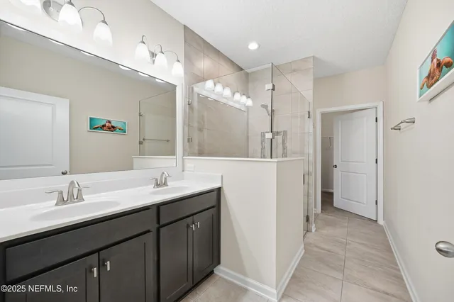 a room with a shower and cabinets