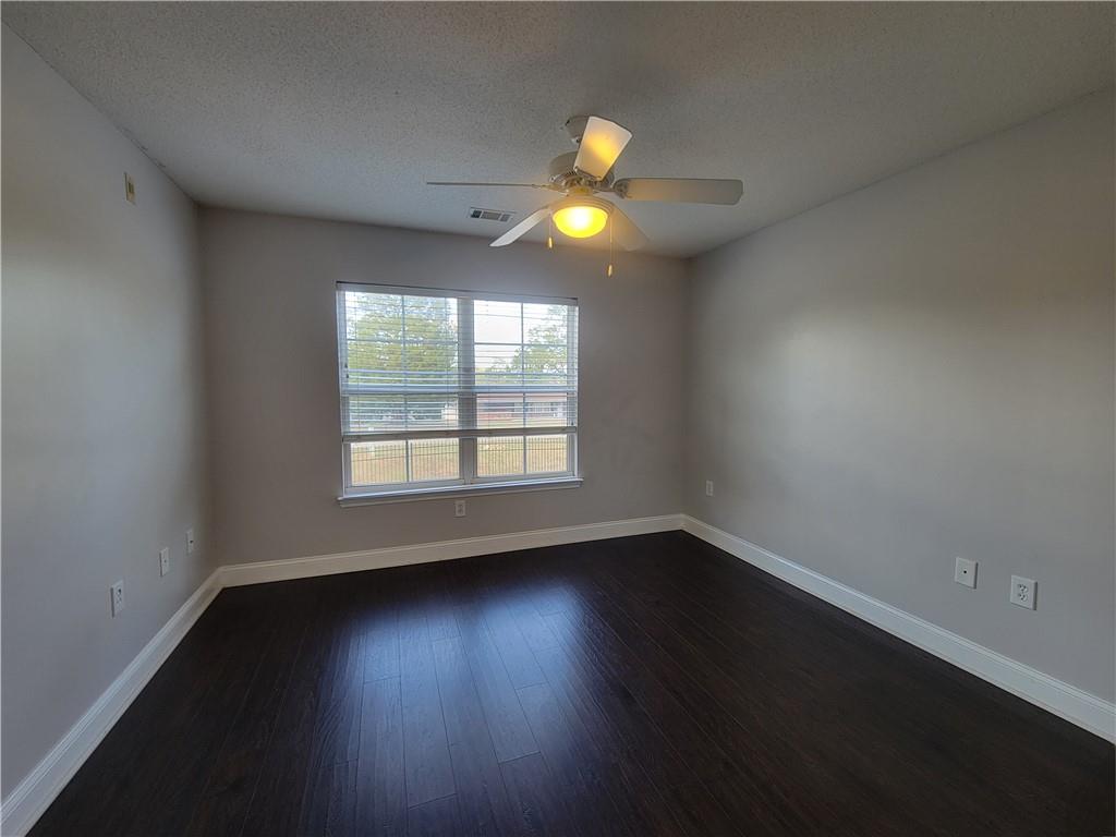321 Lookover Drive Anderson, SC 29621 - Photo 8 of 20 Well-lit room featuring dark wood flooring and a bright ceiling fan.