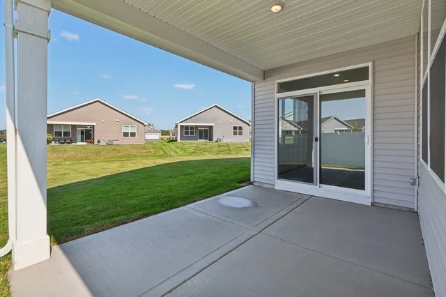 a view of an house with backyard space and garden