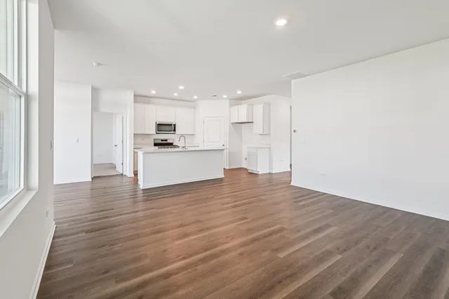 a view of a kitchen with a sink and a stove top oven