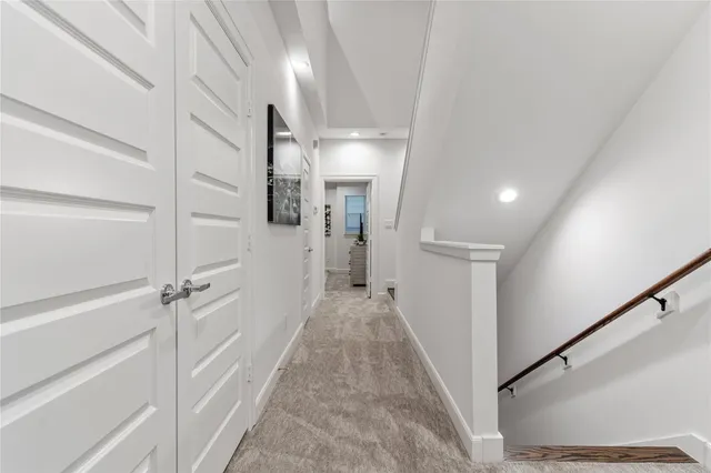 a view of a hallway with a white walls