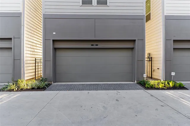 a front view of a house with garage