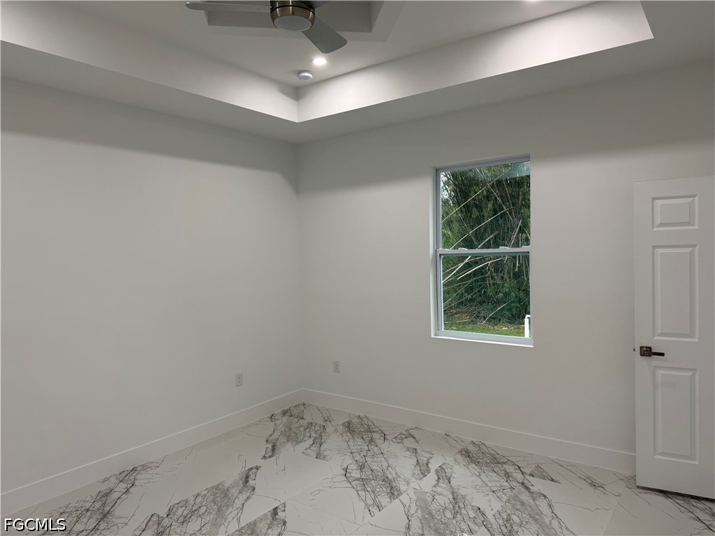 3203 24th Street Southwest Lehigh Acres, FL 33976 - Photo 8 of 19 an empty room with a window