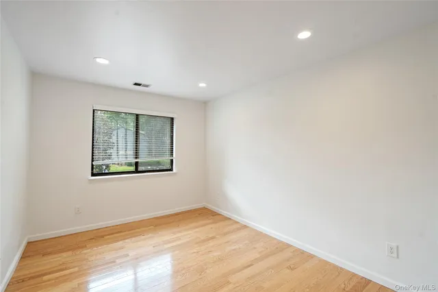 a view of small space with wooden fence