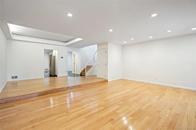 a kitchen with kitchen island a sink stainless steel appliances and cabinets
